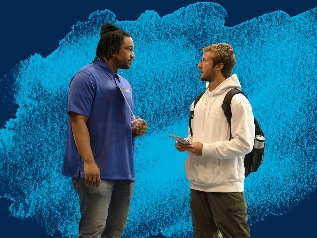Golden1 recruiter speaks with a UC Davis student at a career fair.